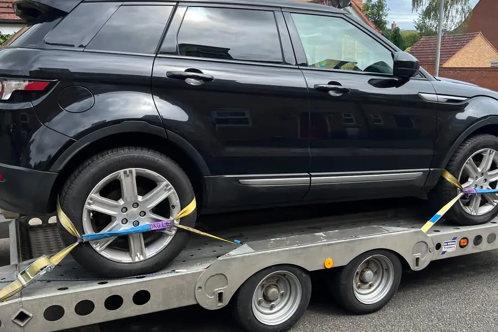 Range Rover Evoque strapped at the wheels