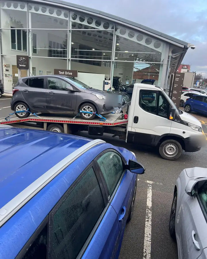 Hyundai i10 on the flatbed at a Hyundai dealership